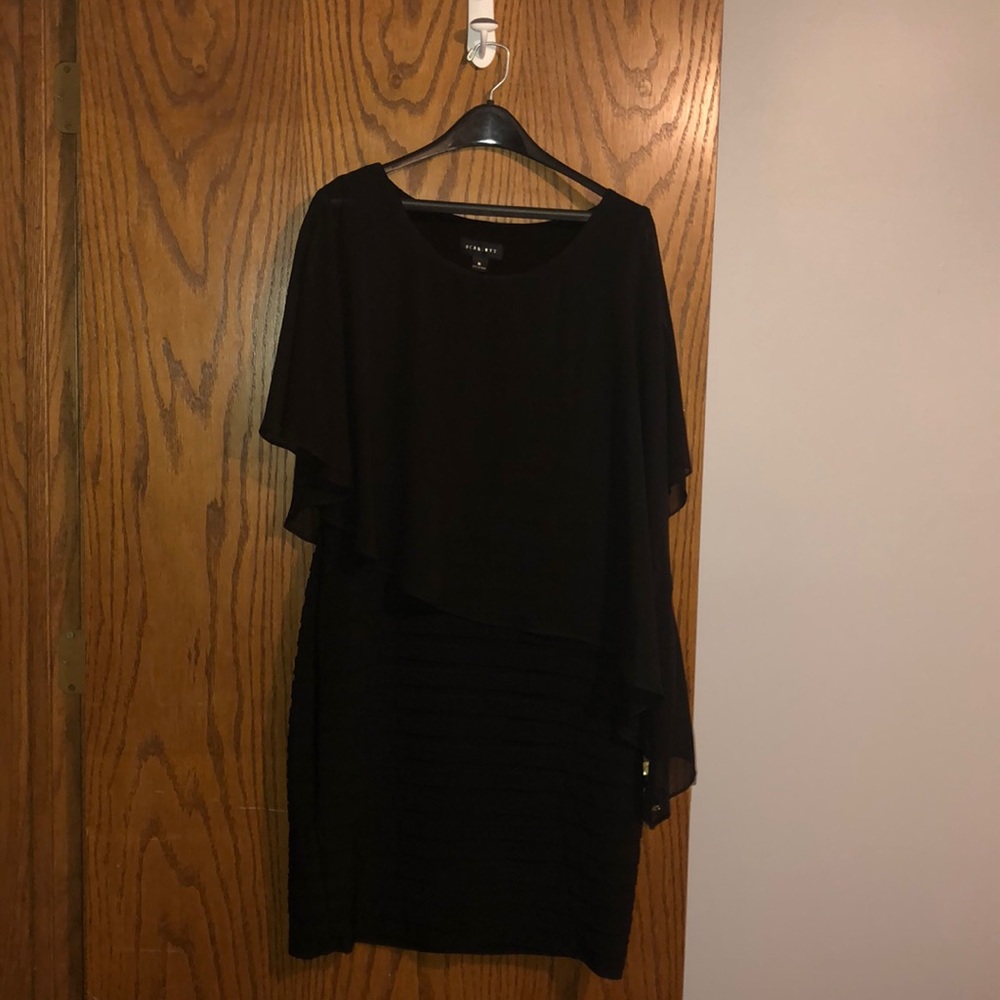 Black evening dress with build in shawl.